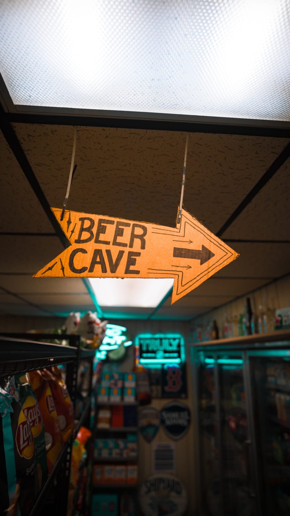 Neon Beer Cave sign over the walk-in cooler
