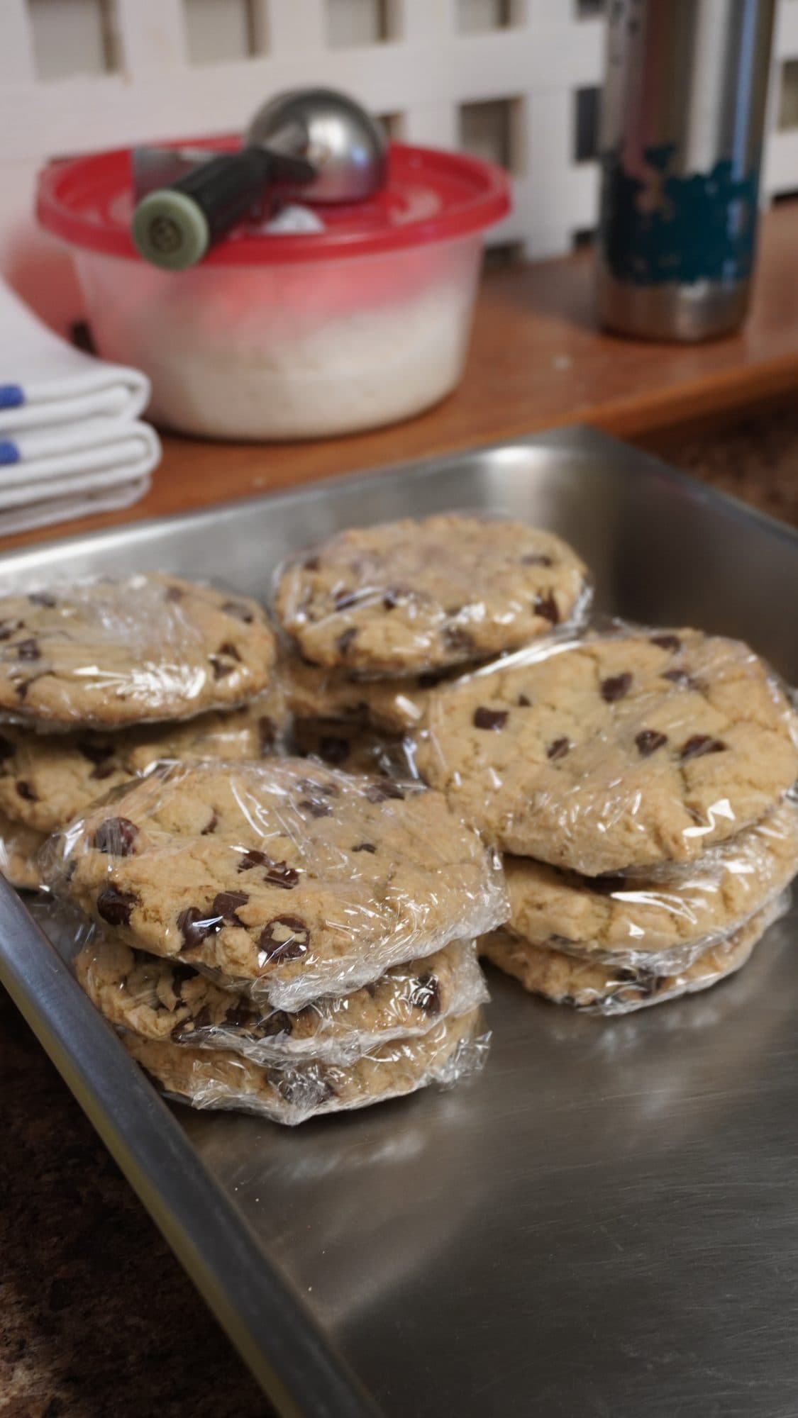 Wrapped chocolate chip cookies on a baking sheet